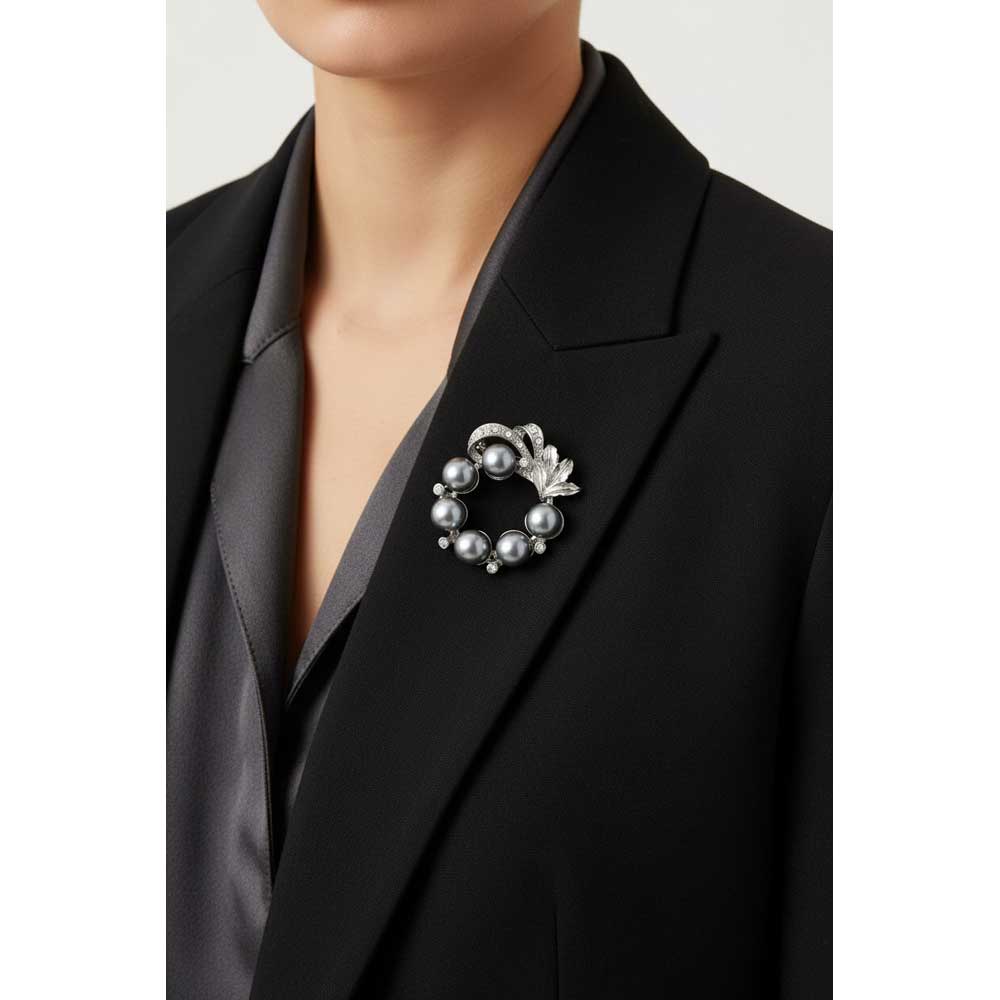 Model wearing Gray pearl wreath brooch pin on a black jacket with a gray shirt - Lilylin Designs