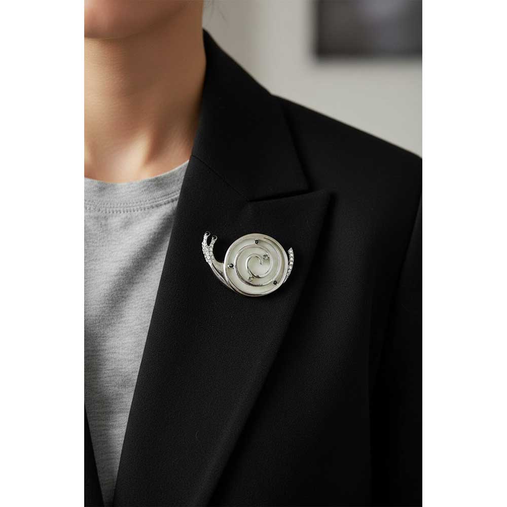 Model wearing Gray snail brooch pin on a black jacket - Lilylin Designs
