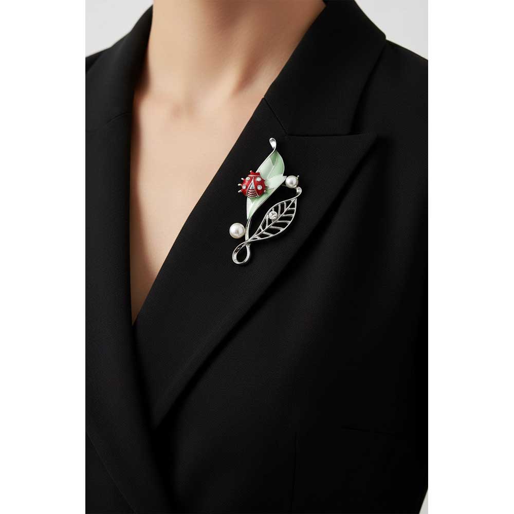 Model wearing Green leaf with red ladybug brooch pin on a black dress - Lilylin Designs