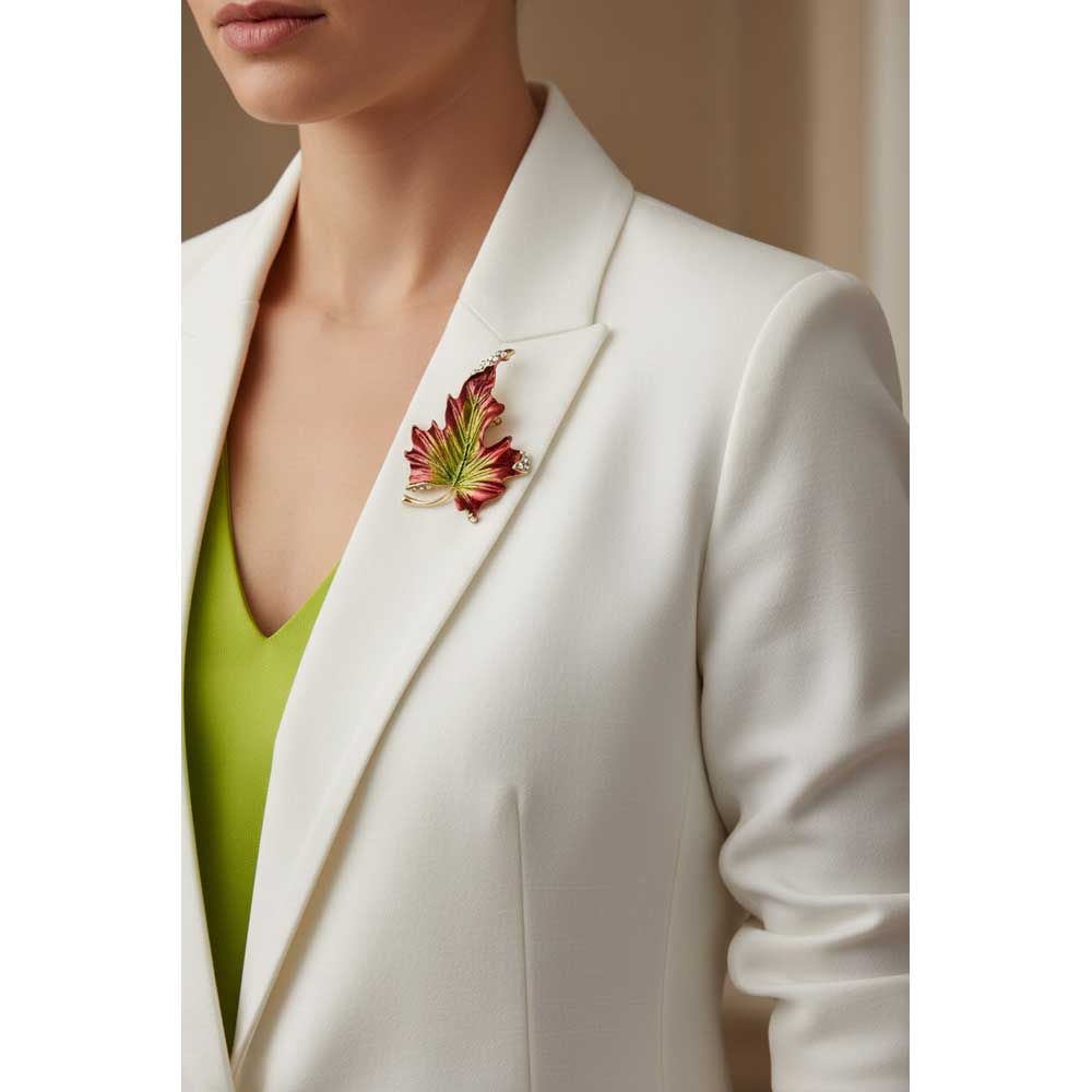 Model wearing Large brown and green leaf brooch pin on a white jacket - Lilylin Designs