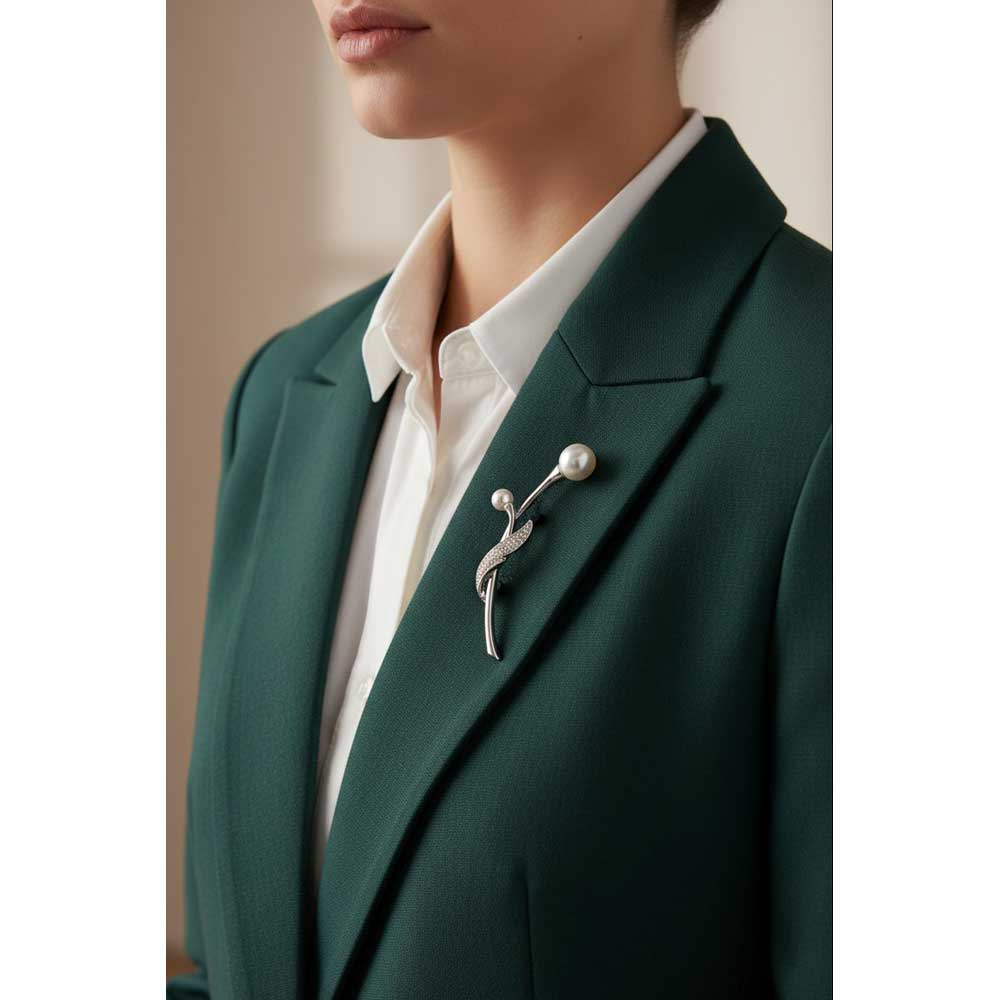 Model wearing Long steam pearl bud brooch pin on a dark green jacket with a white shirt - Lilylin Designs