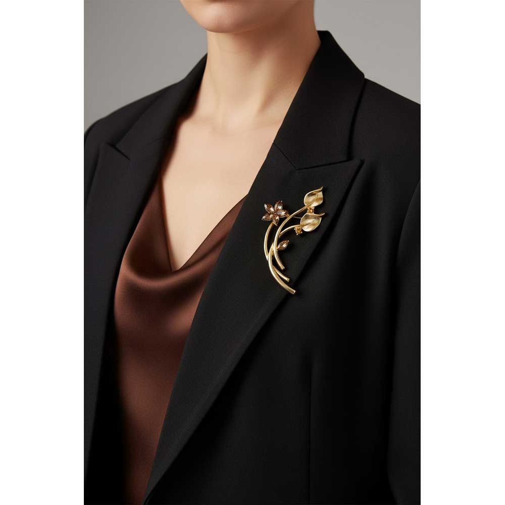 Model wearing long stem brown crystal flower brooch pin on a black jacket over a brown blouse - Lilylin Designs