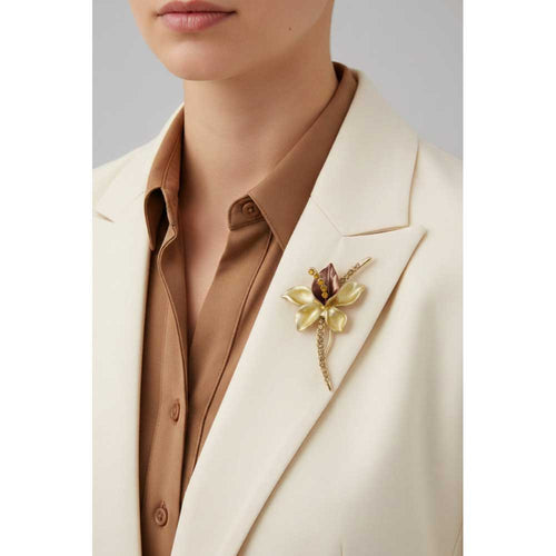 Model wearing Long stem brown flower brooch pin on a cream jacket with a brown shirt - Lilylin Designs