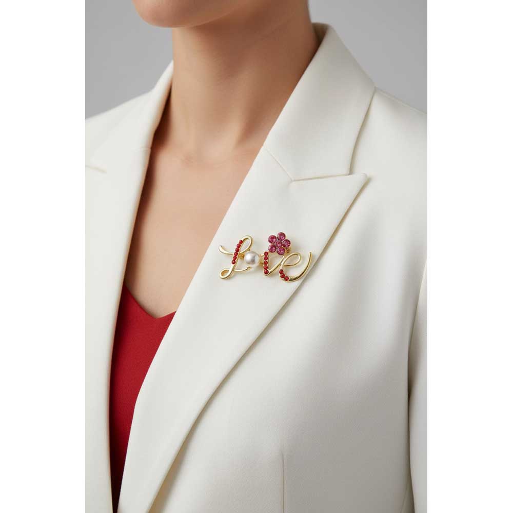 Model wearing "Love" brooch pin on a white jacket - Lilylin Designs