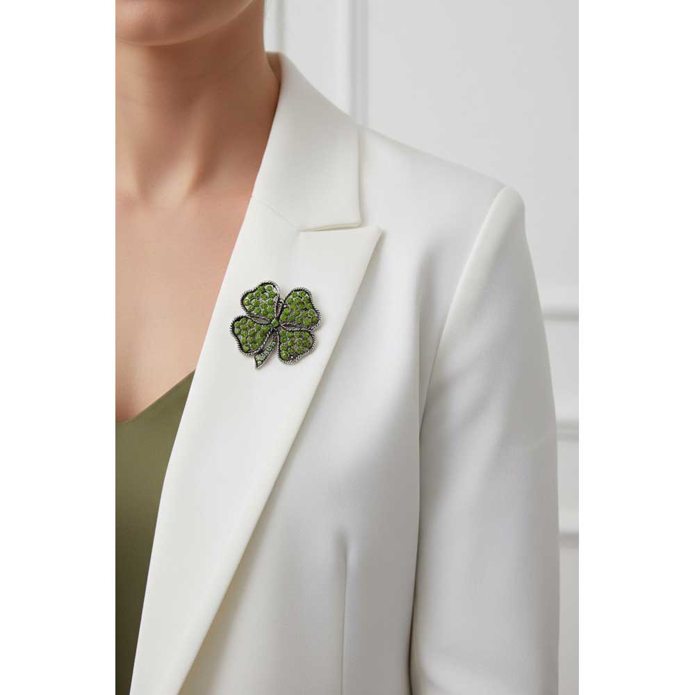 Model wearing Olive green 4 leaf clover brooch pin on a white jacket with a green top - Lilylin Designs