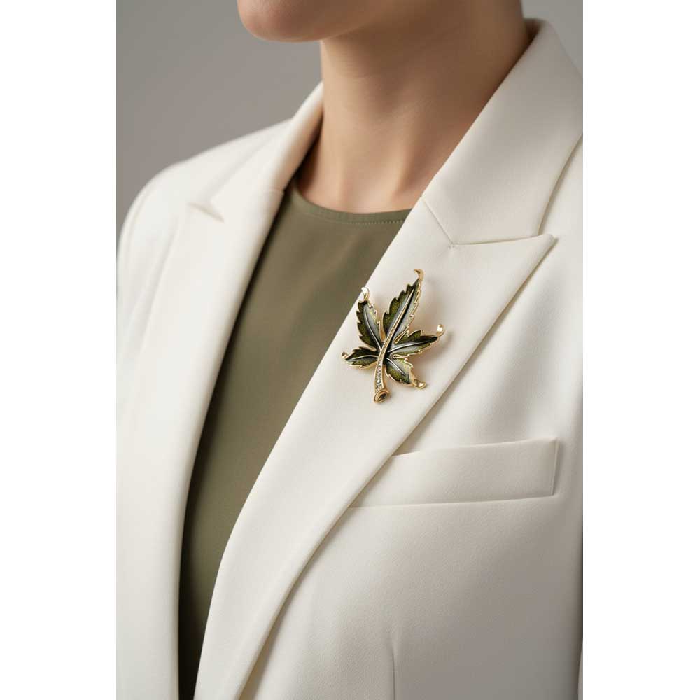 Model wearing Olive green maple leaf brooch pin on a white jacket with an olive green top - Lilylin Designs