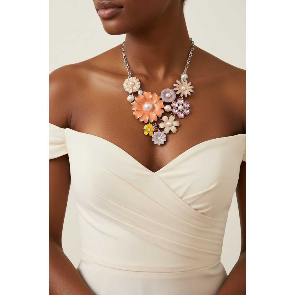 Model wearing Orange floral necklace with a cream off the shoulder dress - Lilylin Designs