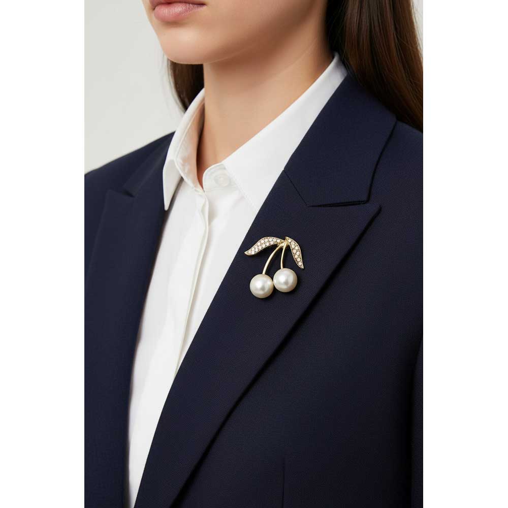 Model wearing Pearl cherries brooch pin on a navy blue jacket with a white shirt - Lilylin Designs