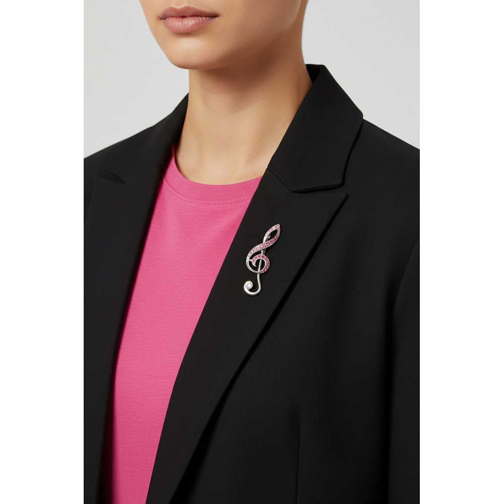 Model wearing Pink g-clef brooch pin on a black jacket with a pink top - Lilylin Designs