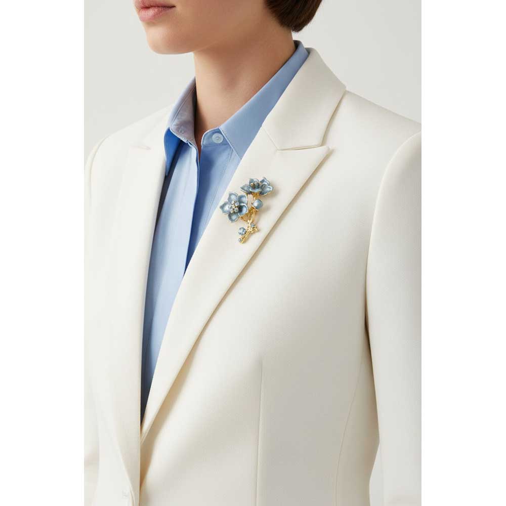 Model wearing Powder blue flower brooch pin  on a white jacket with a light blue shirt - Lilylin Designs