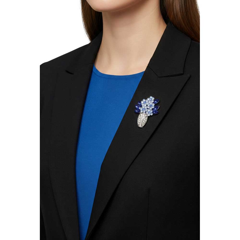 Model wearing Silver vase with blue flowers brooch pin on a black jacket with a blue shirt - Lilylin Designs