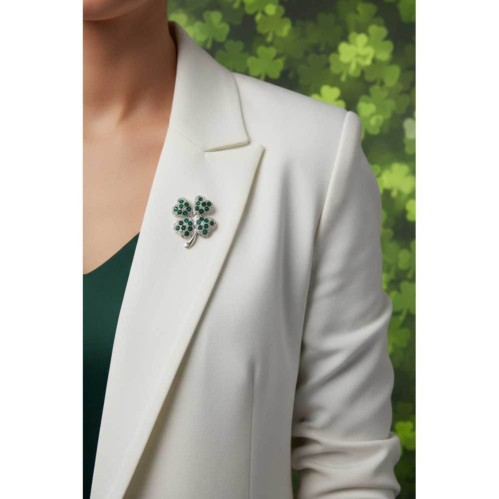 Model wearing Small green 4 leaf clover brooch pin on a white jacket with clover background - Lilylin Designs