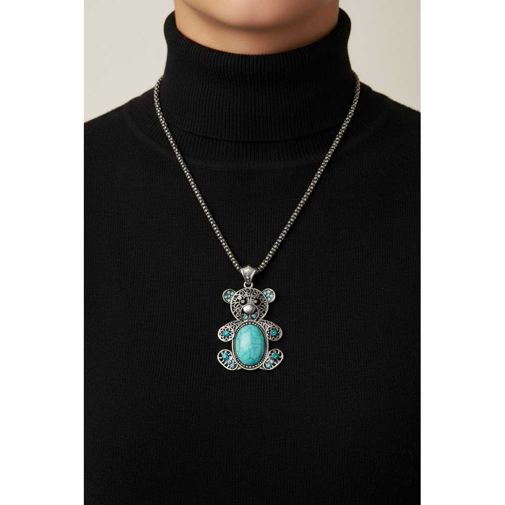 Model wearing large Turquoise teddy bear necklace on a black turtleneck sweater - Lilylin Designs