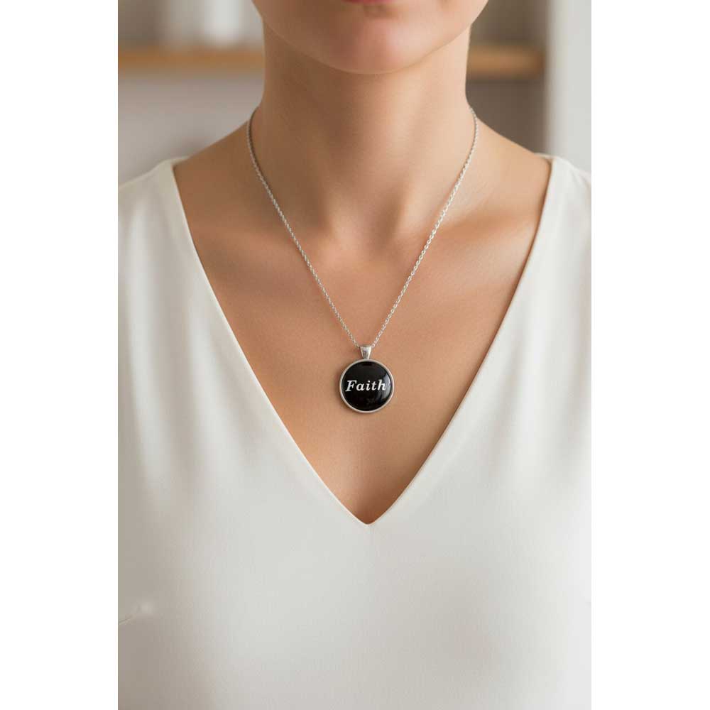 Model wearing Lilylin Designs black with white "Faith" necklace with a white dress