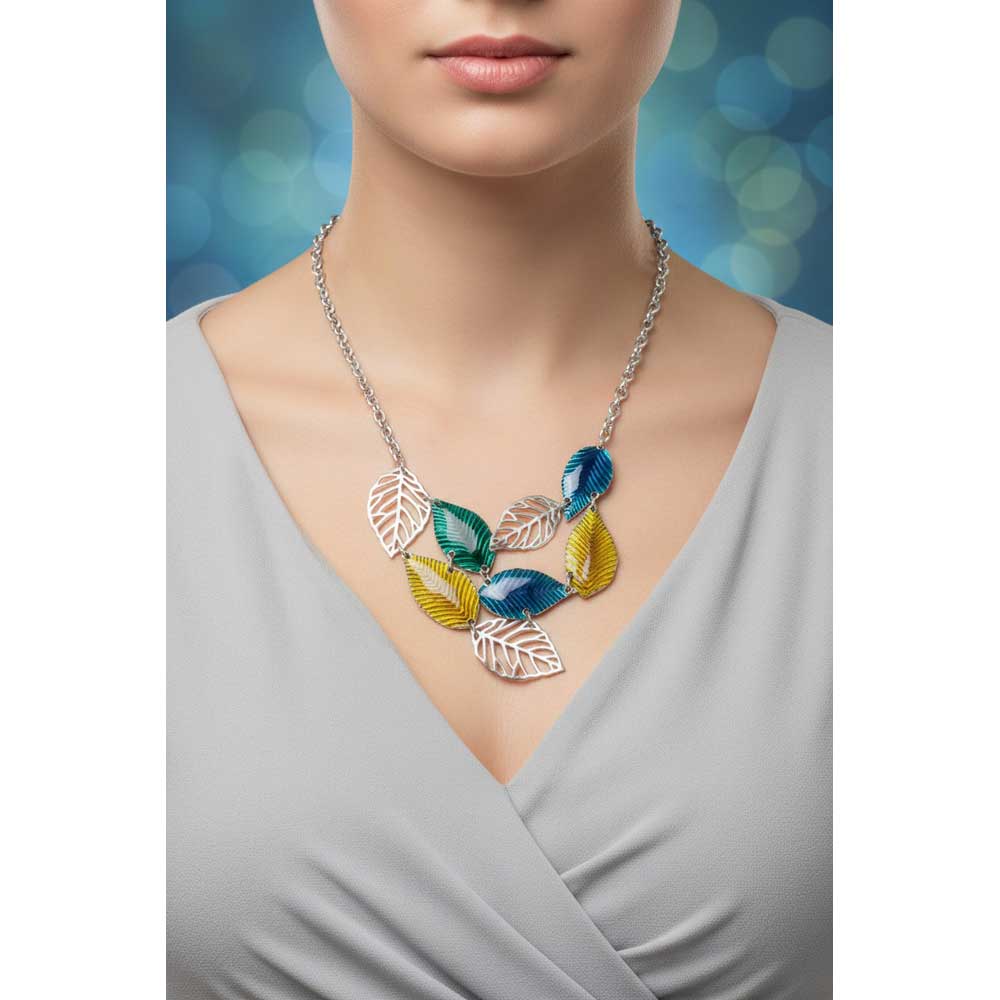 Model wearing blue yellow and green leaves necklace with a gray dress - Lilylin Designs