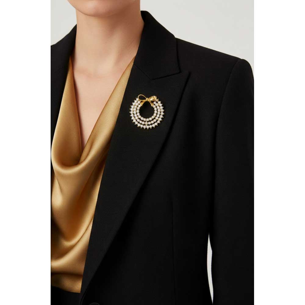 Model wearing clear crystal wreath pin on a black jacket - Lilylin Designs