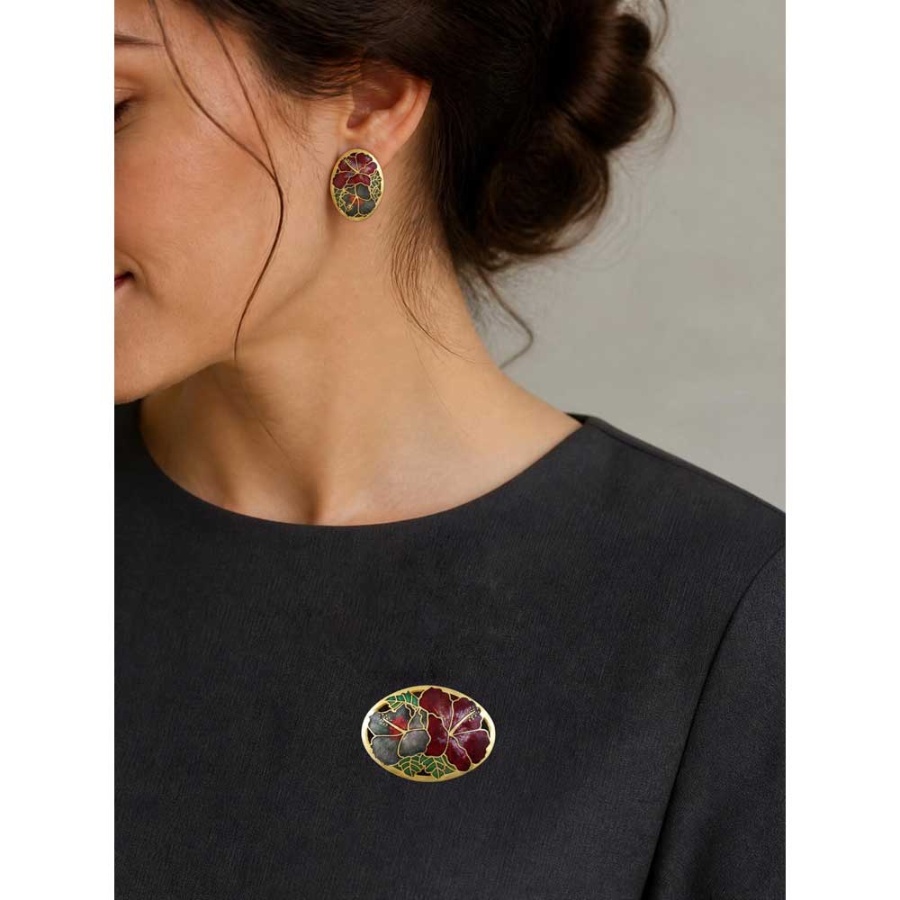 Model wearing red and gray hibiscus cloisonne pin and earring set - Lilylin Designs