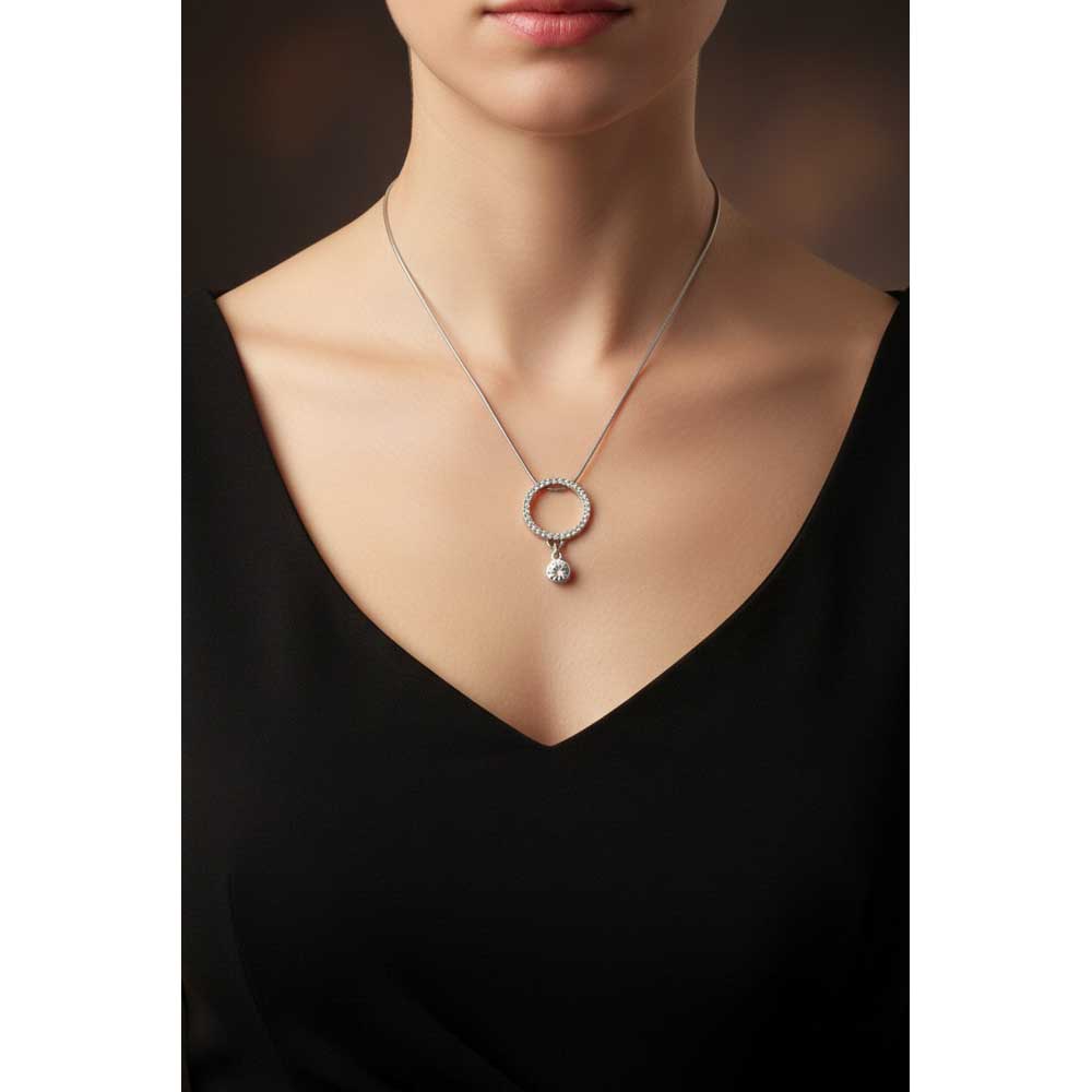 Model wearing crystal infinity circle necklace with dangling crystal charm - Lilylin Designs