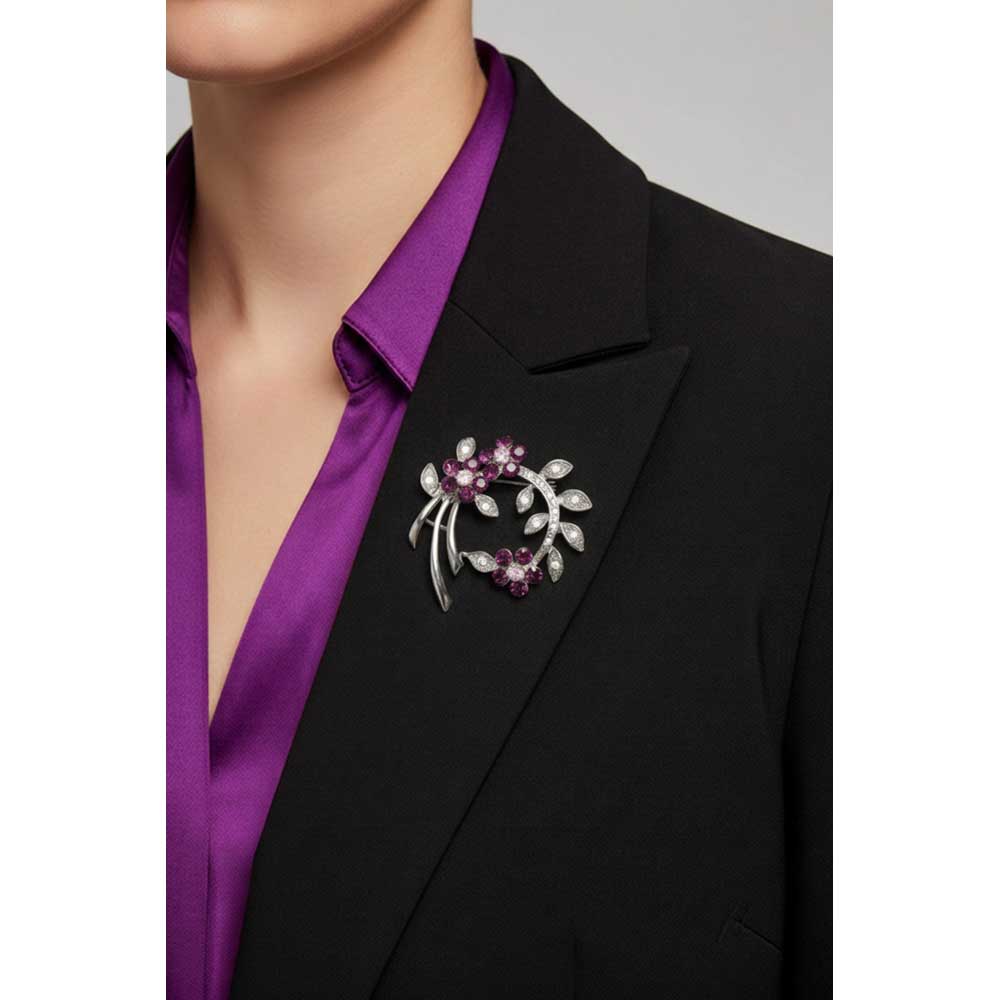 Model waring curved branch with purple crystal flowers brooch pin on a black jacket with a purple shirt - Lilylin Designs