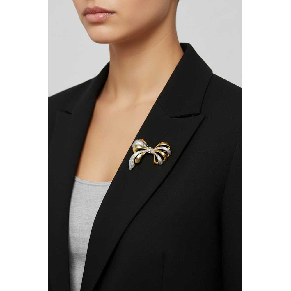 Model wearing gold with silver glitter bow pin on a black jacket - Lilylin Designs