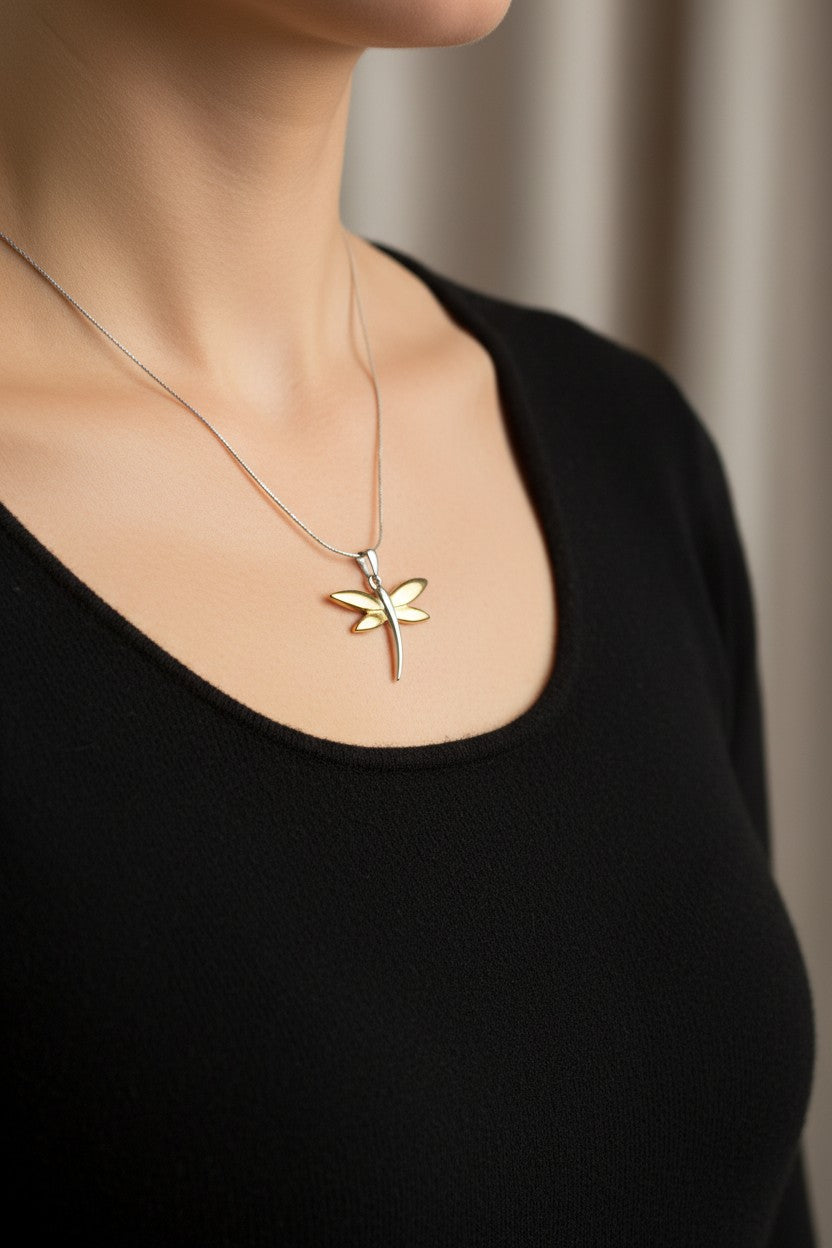 Model wearing gold and silver dragonfly necklace with a black top - Lilylin Designs