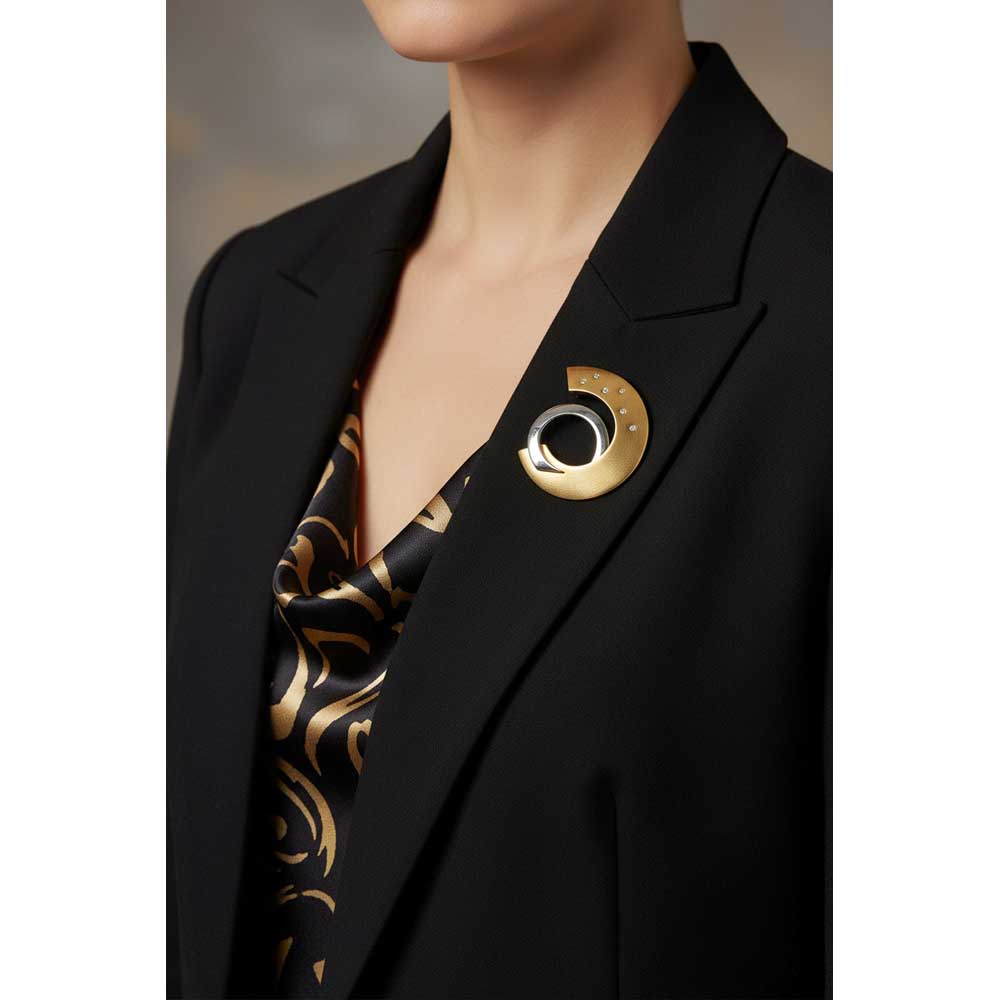 Model wearing gold and silver half circle brooch pin on a black jacket - Lilylin Designs