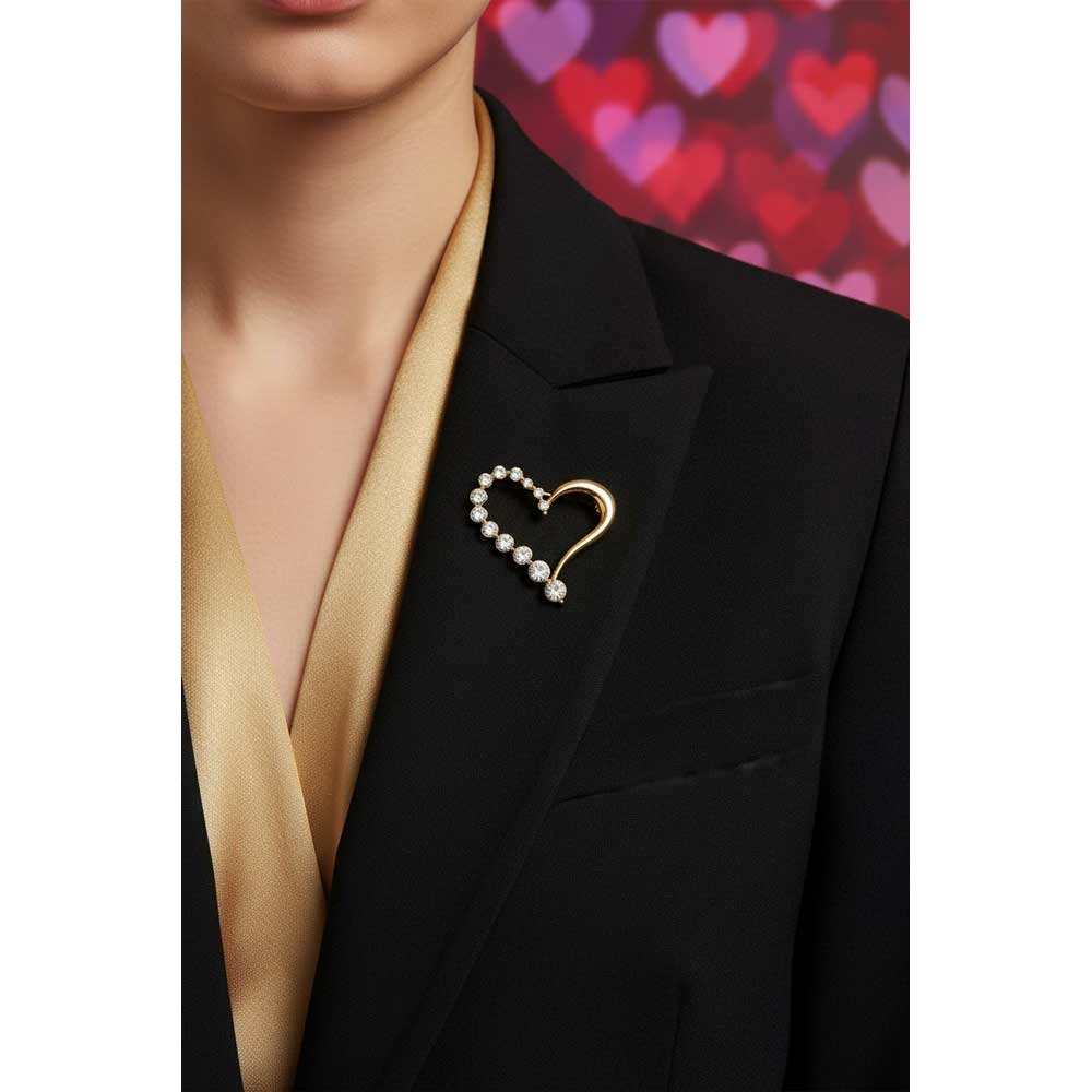 Model wearing gold open crystal heart brooch pin on a black jacket with a gold top - Lilylin Designs