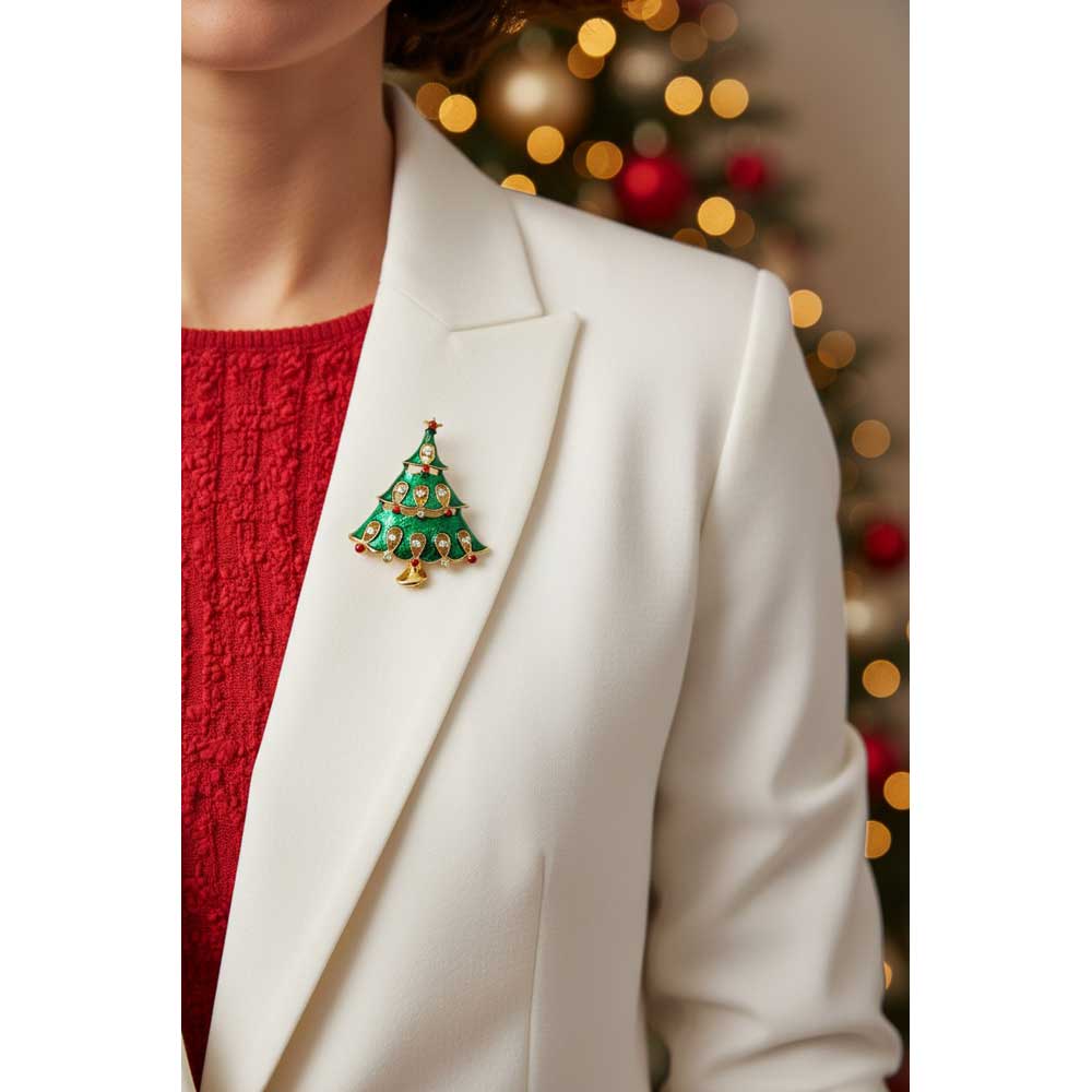 Model wearing green enamel Christmas tree brooch pin on a white jacket with a red sweater - Lilylin Designs