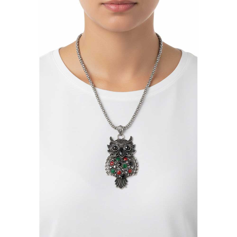 Model wearing large colorful owl necklace with a white t-shirt - Lilylin Designs