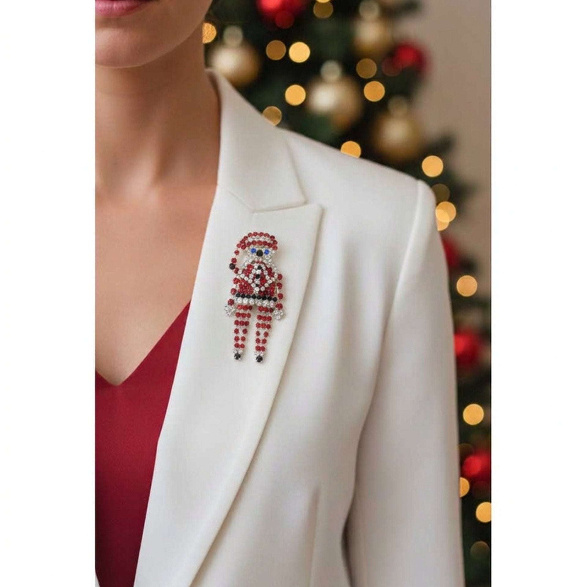 Model wearing large crystal Santa brooch on a white jacket with a red shirt - Lilylin Designs