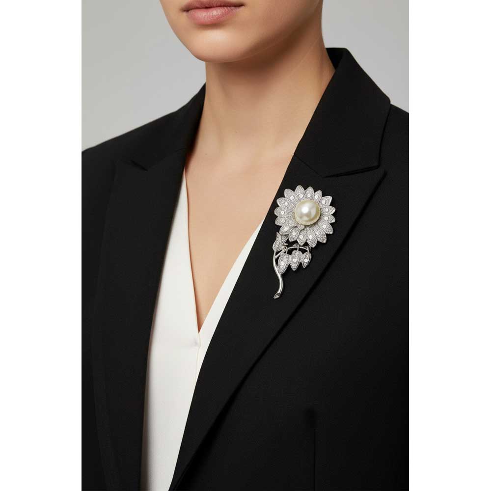 Model wearing Pearl sunflower brooch pin on a black jacket with a white top - Lilylin Designs