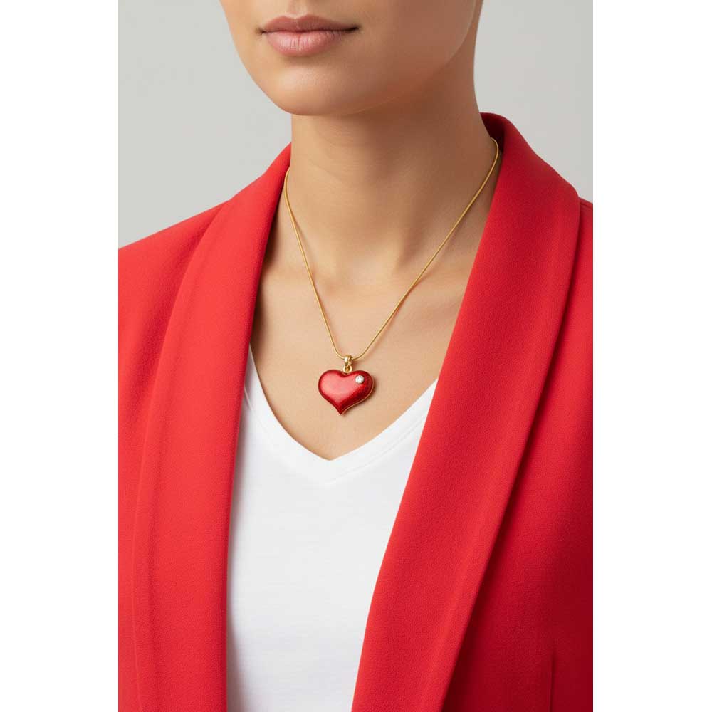 Model wearing red enamel heart necklace with a red jacket and a white v neck shirt - Lilylin Designs