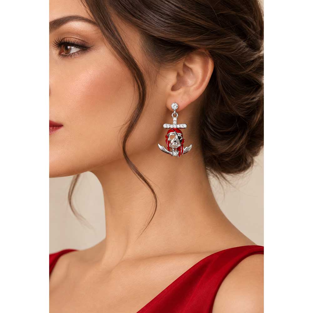 Model wearing red pirate skull and cross bones earring with a red dress - Lilylin Designs