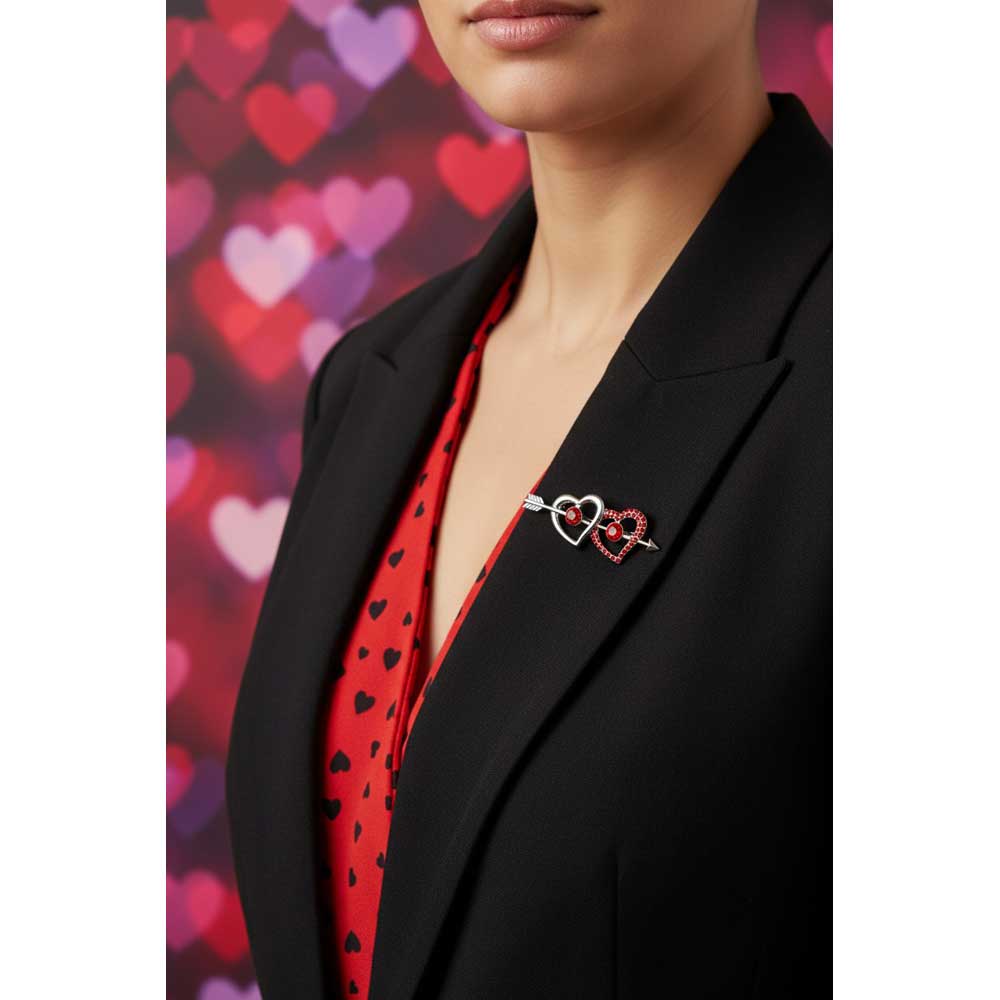 Model wearing silver and red hearts with arrow brooch pin on a black jacket - Lilylin Designs