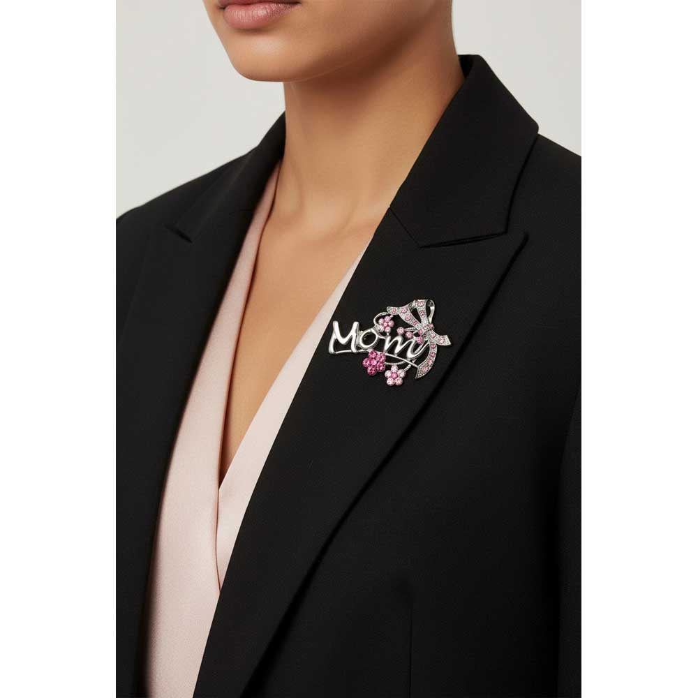 Model wearing silver mom pin with pink daisies and bow on a black jacket - Lilylin Designs