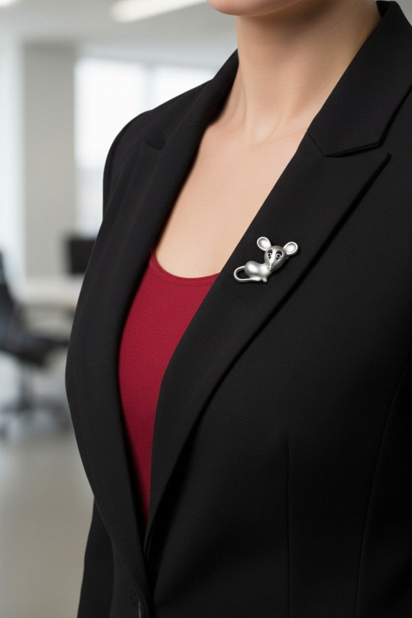 Model wearing silver mouse pin on black jacket with red top. Lilylin Designs