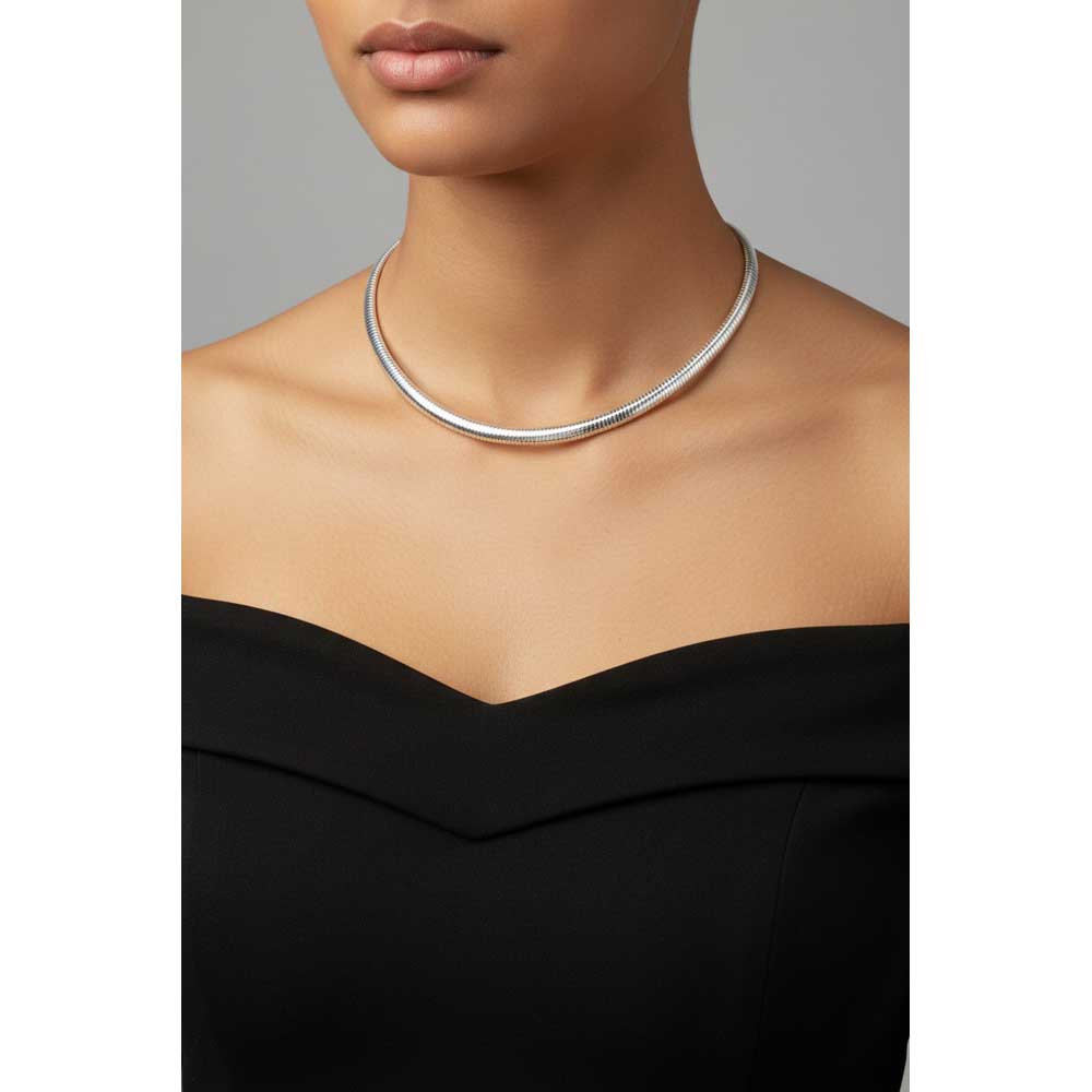 Model wearing flexible silver-tone omega necklace with an off the shoulder black dress - Lilylin Designs