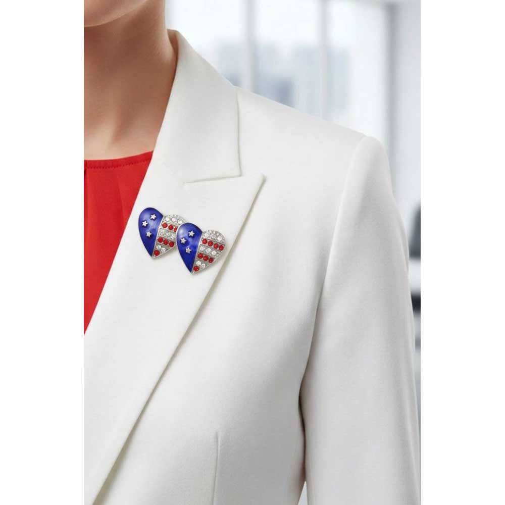 Model wearing double silver patriotic heart brooch pin on a white jacket - Lilylin Designs