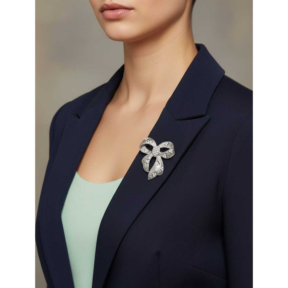 Model wearing textured silver pin on a blue jacket - Lilylin Designs