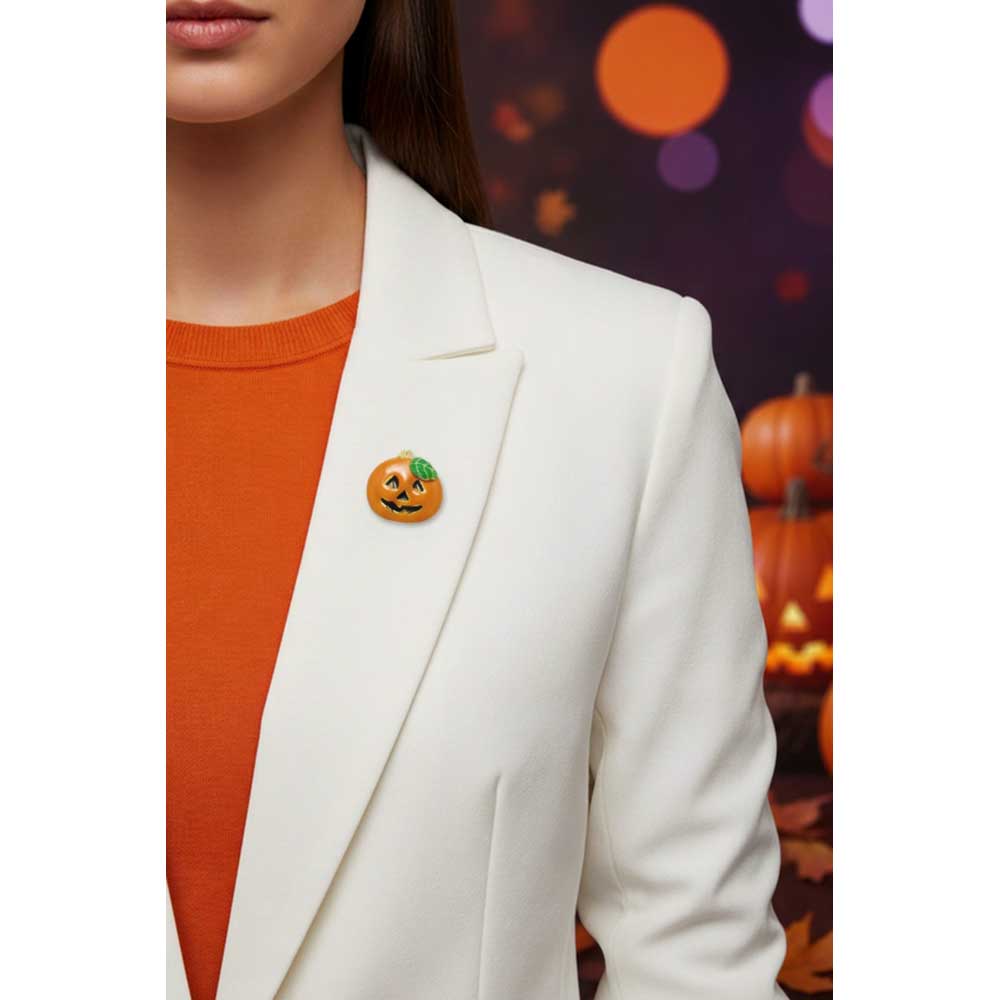 Model wearing small jack o lantern pumpkin pin on a white jacket with a Halloween background - Lilylin Designs