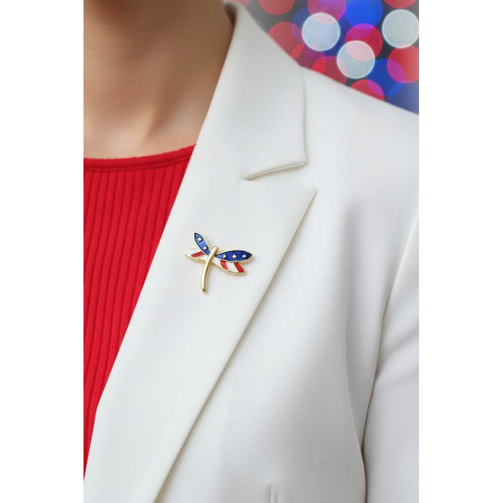 Model wearing small red white and blue patriotic dragonfly lapel tac pin on a white jacket with a red top - Lilylin 
Designs