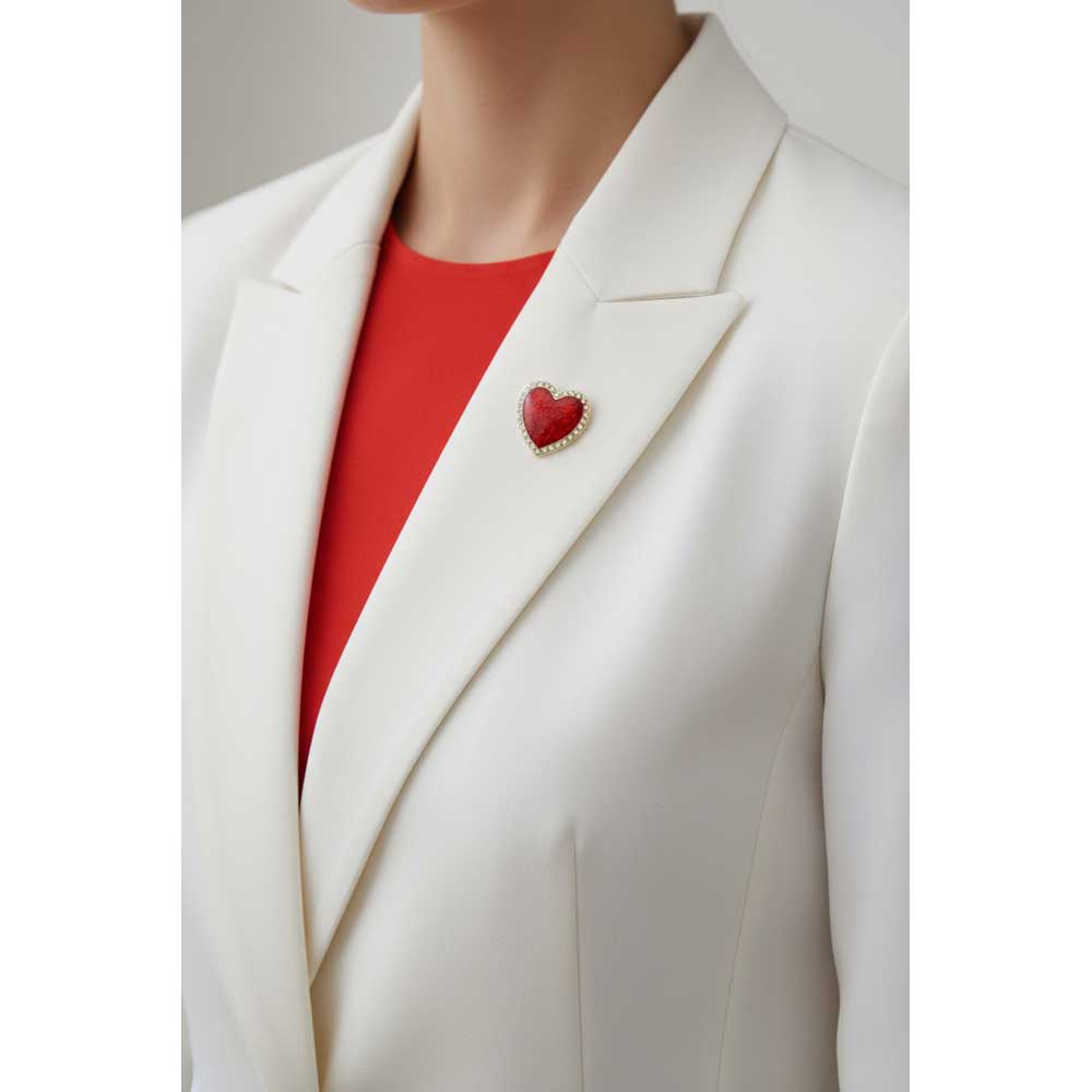 Model wearing small red heart lapel tac pin on a white jacket with a red top - Lilylin Designs