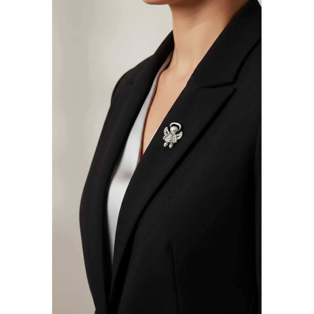 Model wearing small silver pearl head angel lapel tac pin on a black jacket - Lilylin Designs