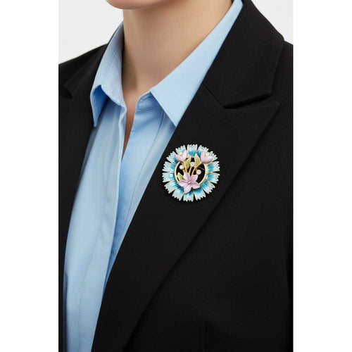 Model wearing Blue spiky wreath flower brooch pin on a black jacket with a light blue top - Lilylin Designs