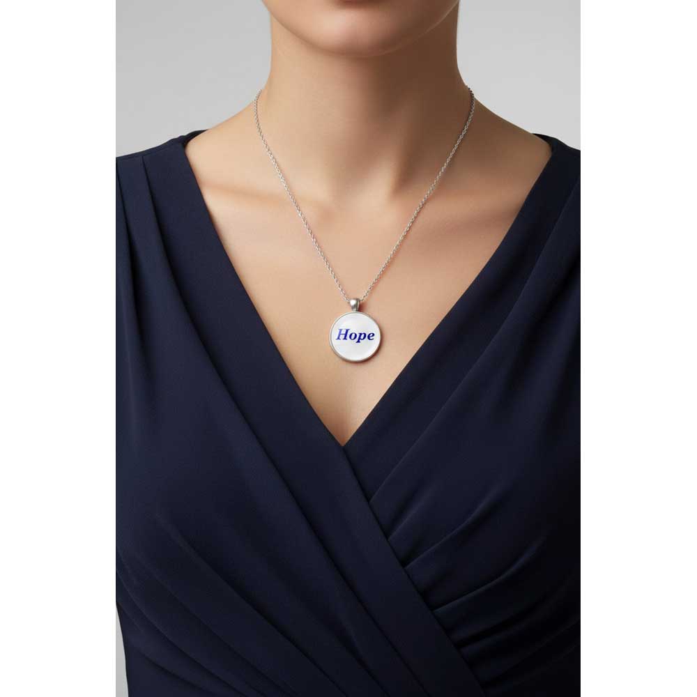 Model wearing Lilylin Designs white with blue "Hope" necklace with a dark blue dress