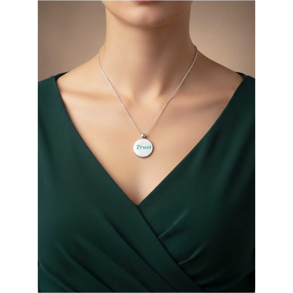 Model wearing Lilylin Designs with with green "Trust" necklace with a green dress