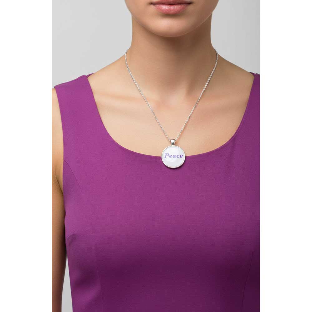 Model wearing Lilylin Designs with with purple "Peace" necklace with a purple dress