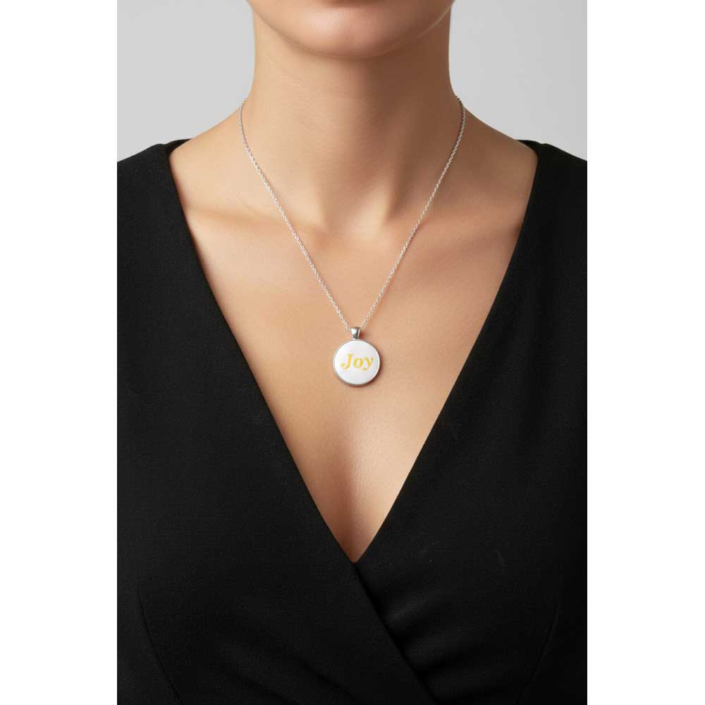 Model wearing Lilylin Designs handcrafted white with yellow "Joy" necklace with a black dress