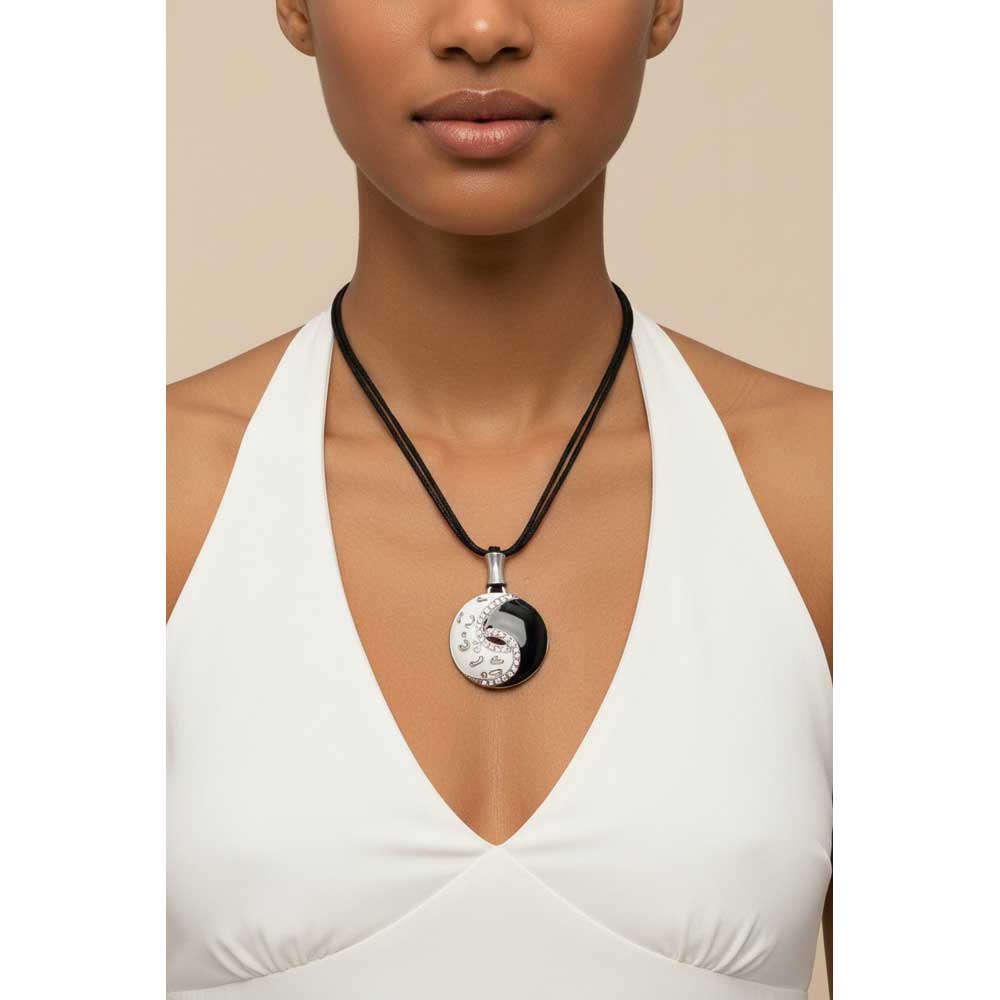 Model wearing black and white enamel and crystal yin yang necklace with a white halter top - Lilylin Designs