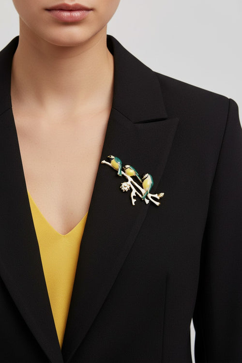 Model wearing 3 birds on a branch pin on a black jacket - Lilylin Designs